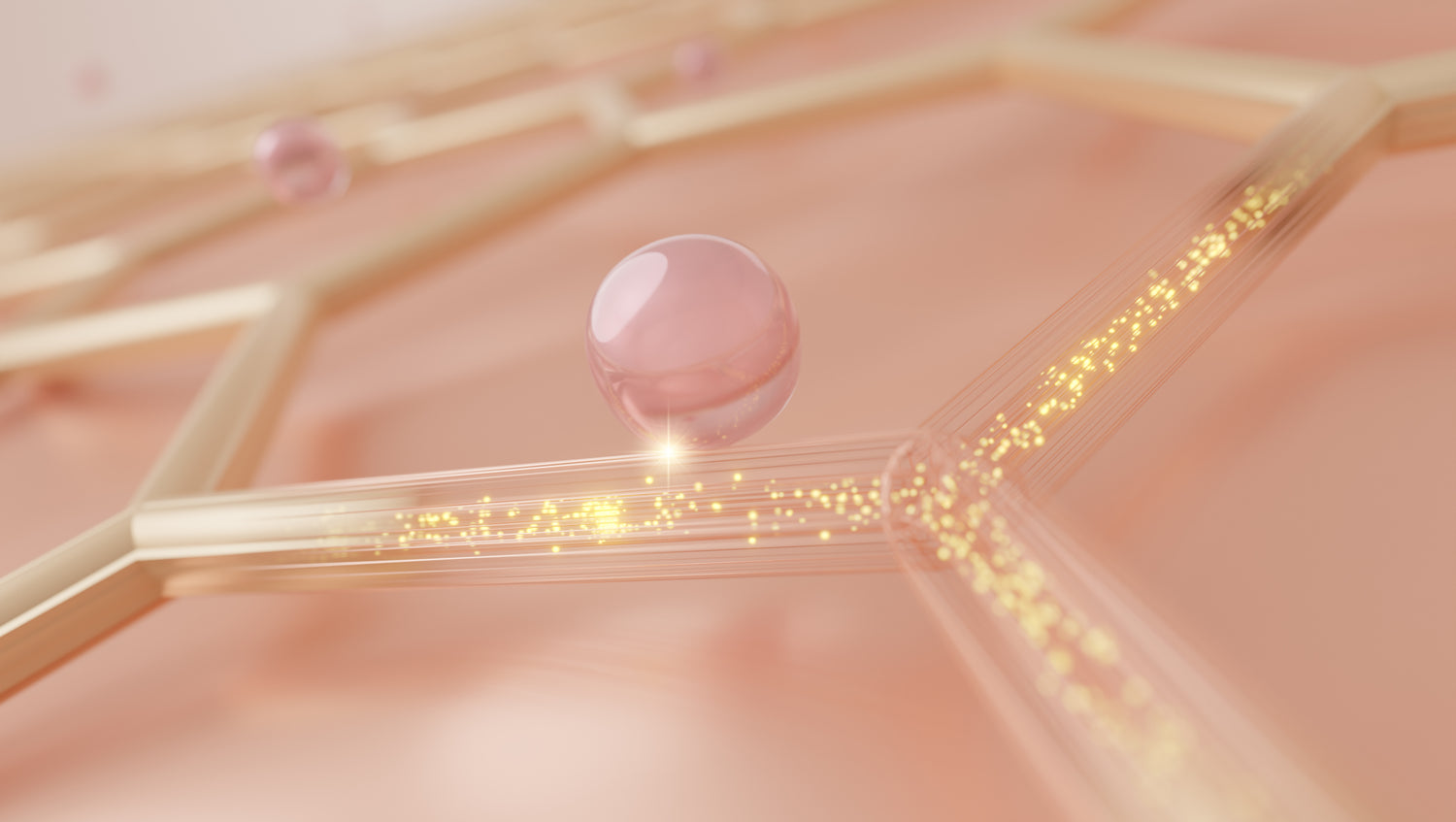 Close-up of a droplet on a textured surface with a soft pink background
