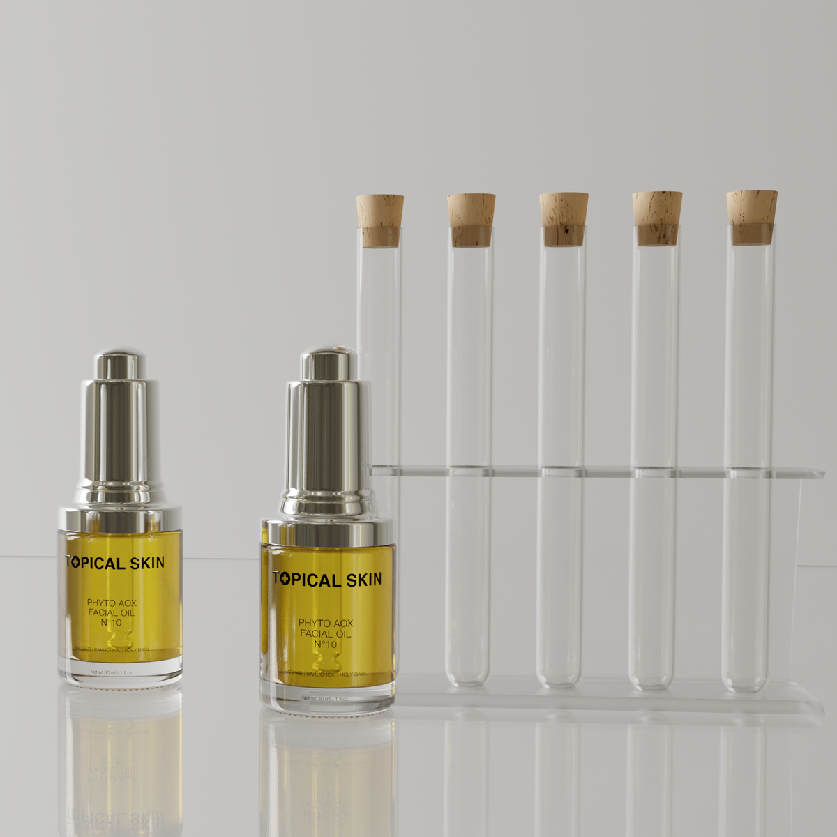 Four amber glass skincare dropper bottles labeled 'TOPICAL SKIN' arranged on a reflective surface, with four clear test tubes with cork stoppers and a clear rack behind them on a light gray studio background.