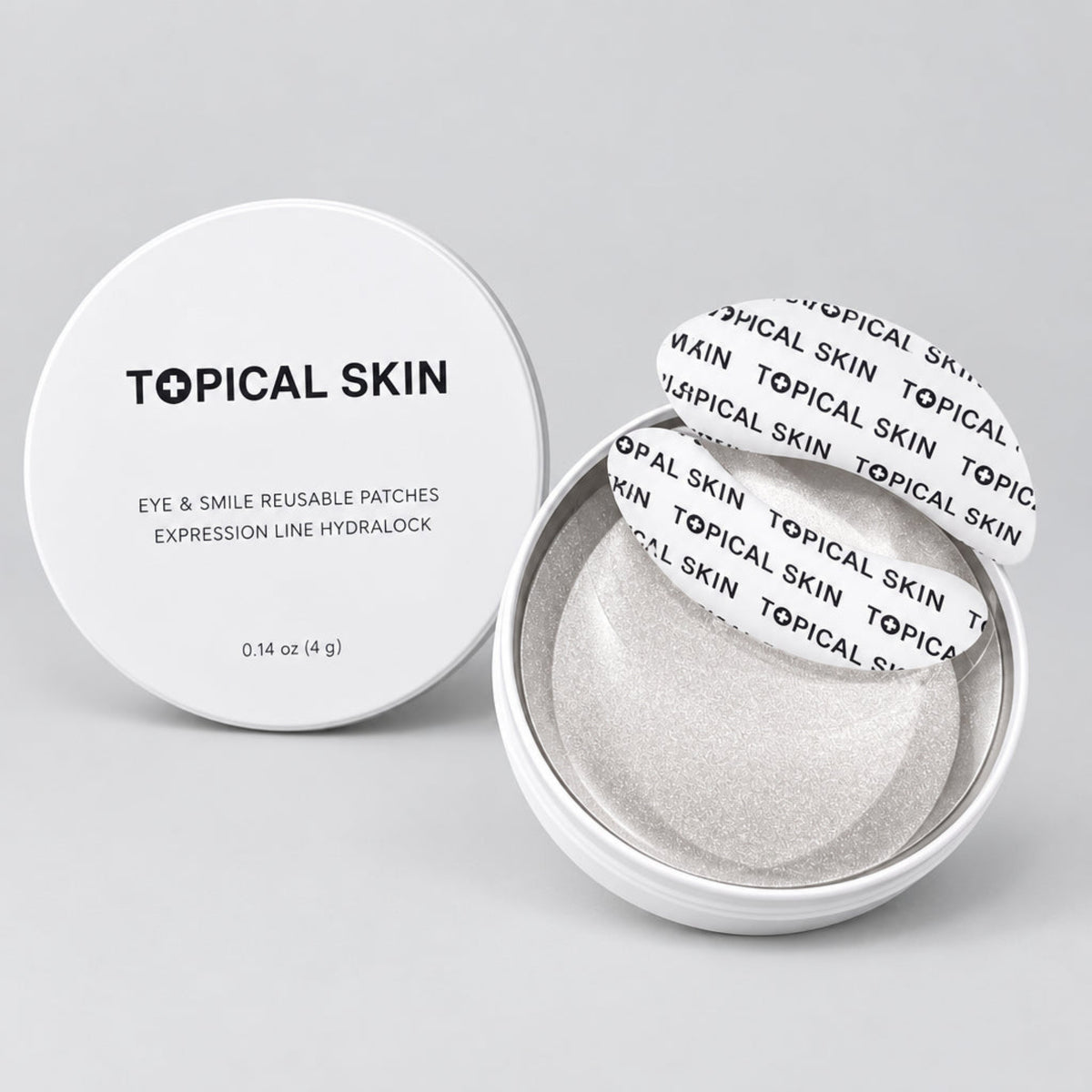 Topical Skin eye and smile reusable patches in a round clear container, with the white lid placed beside the open container showing the patches inside.
