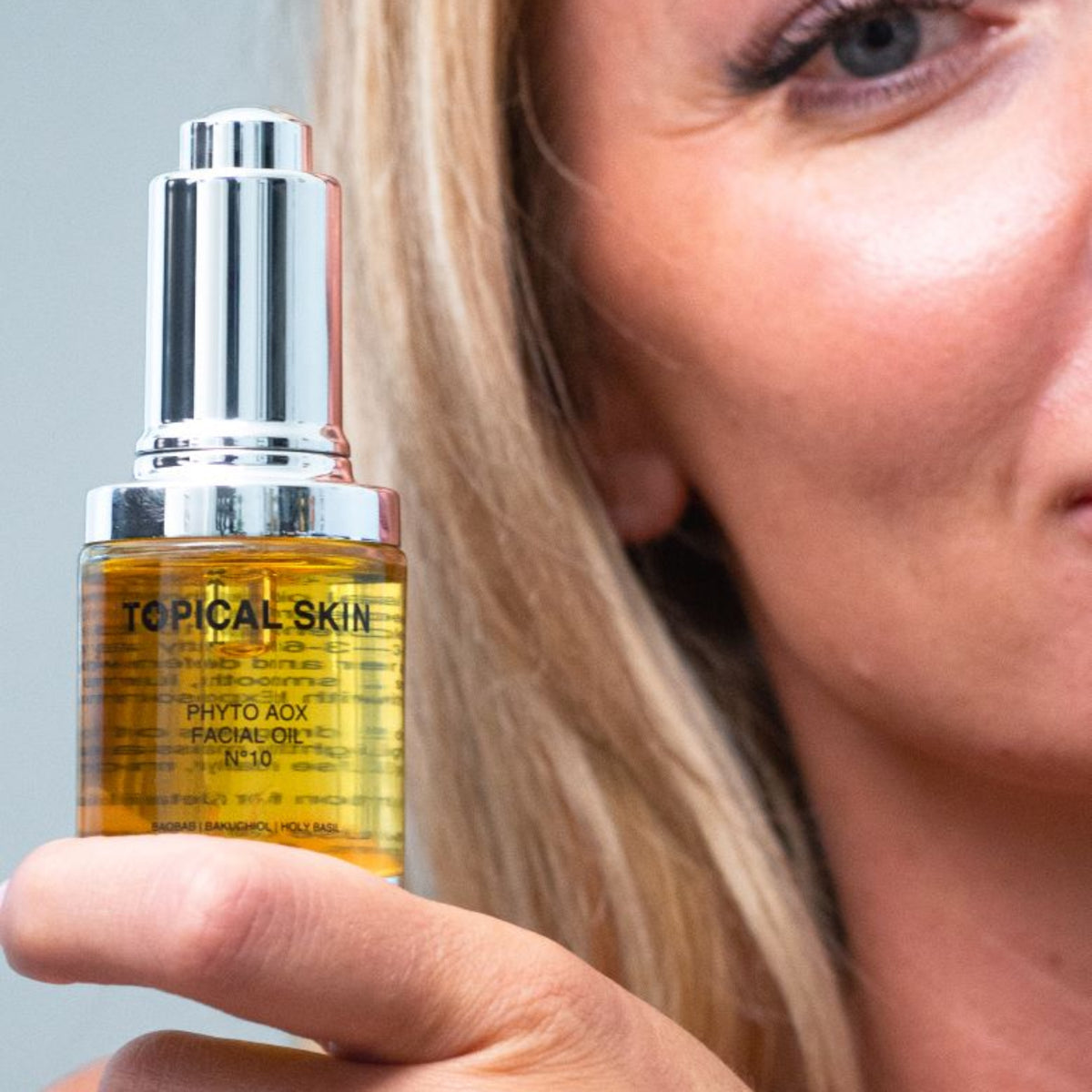 Phyto AOX Facial Oil N°10 with Exposome Defense Technology antioxidant TOPICAL SKIN CLEAN DERMACEUTICALS face oil, amber in glass with silver cap.